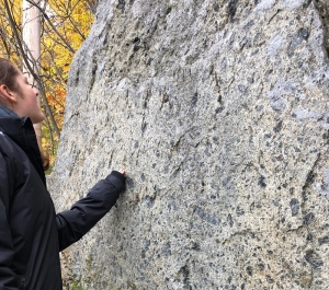 Student inspecting a rock formation